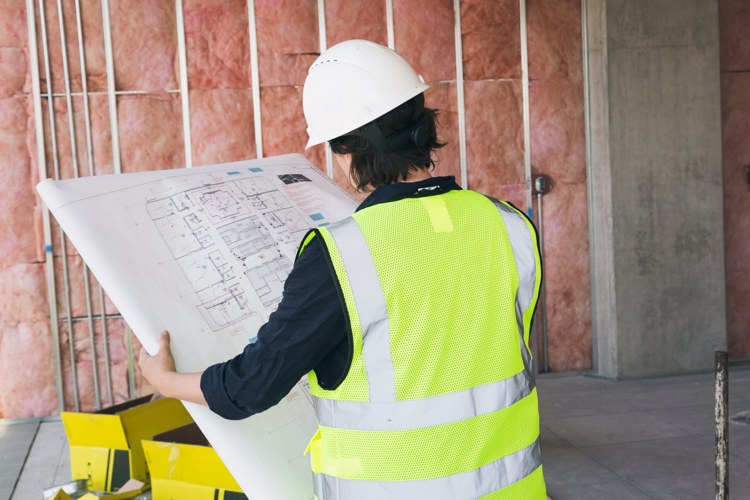 construction-worker-holding-blueprints